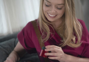 woman holding tiny sound machine